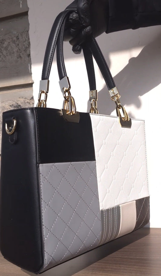 Chrisbella black color-block tote bag with quilted panels and gold hardware
