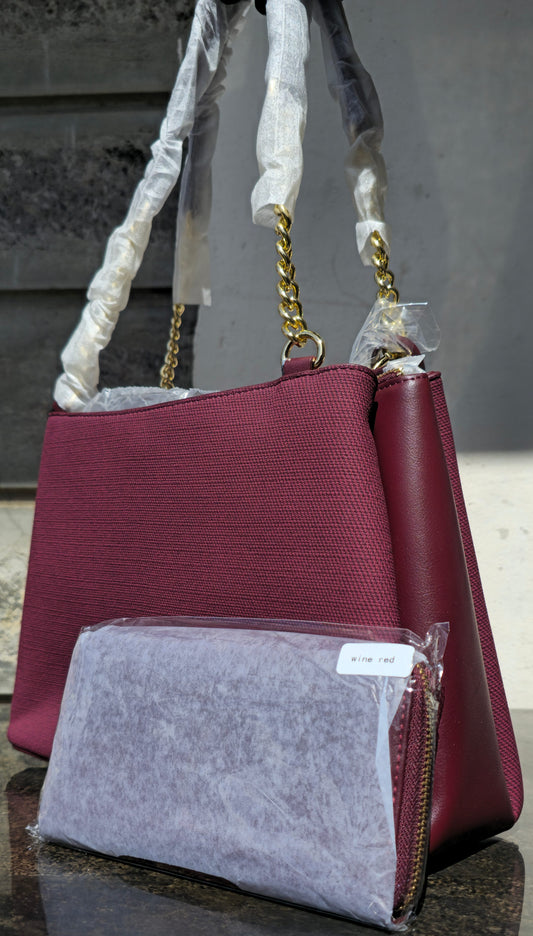 Chrisbella wine red canvas tote with leather panels, gold chain strap, and matching pouch